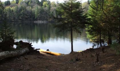 The tranquil waters of Little Tupper Lake beckon the paddler, angler, and backcountry camper.