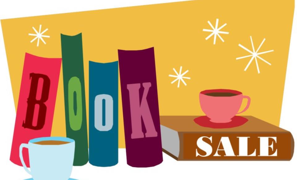 A cartoon image of four books standing upright, each with a letter on it that spells out the word book. a fifth book is laying down and on its edge is the word sale. There are also a tea cup and a coffee mug near the books