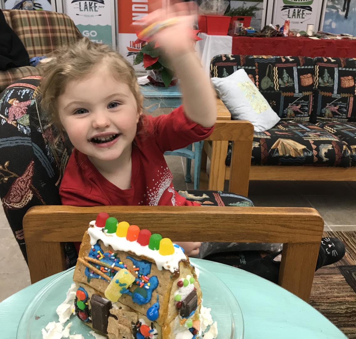 Child with gingerbread house