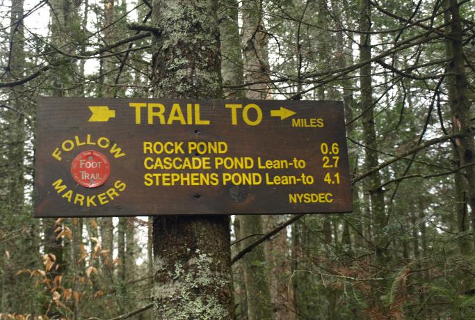 Look for the trailhead sign for Cascade Pond.