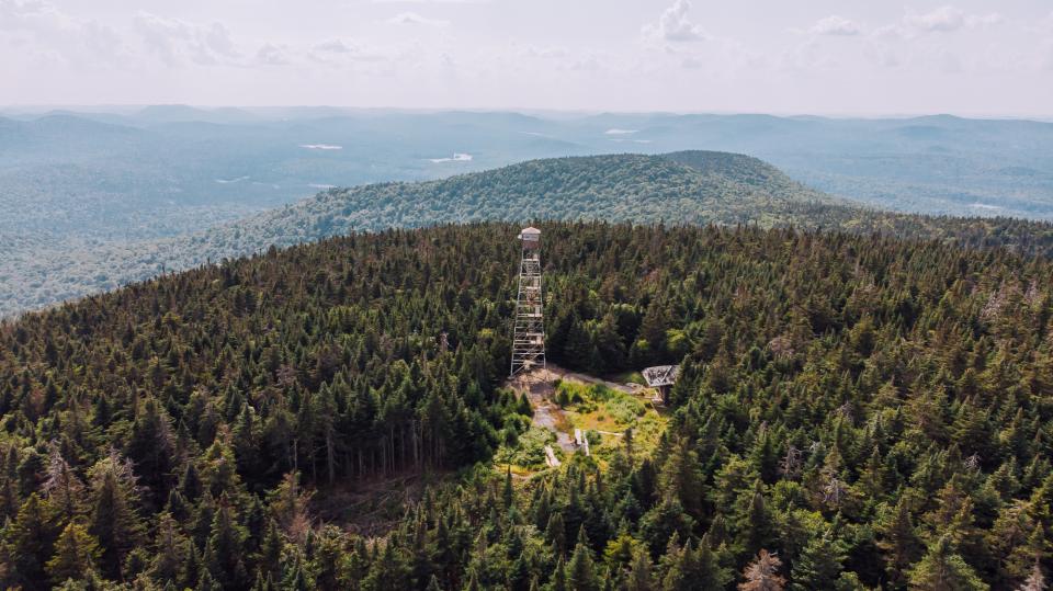 An aerial view of a fire tower on an Adirondack peak.