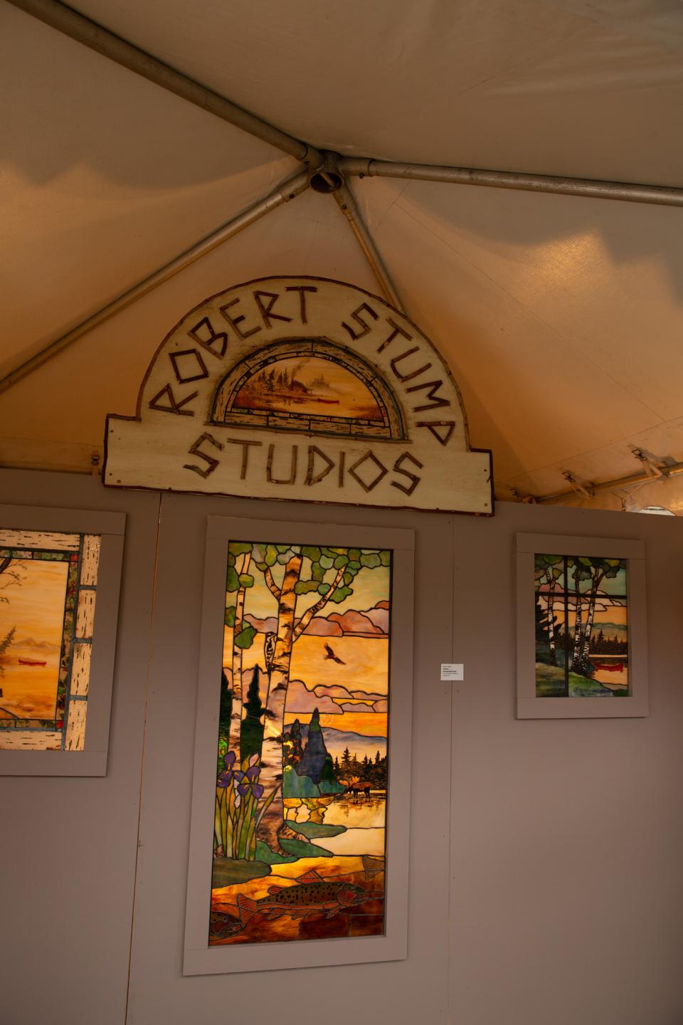 Robert Stump Studios stained glass design display.