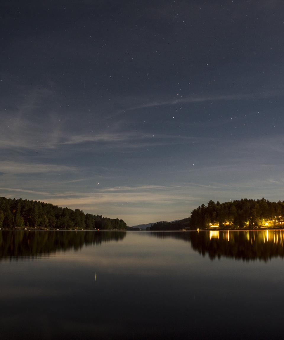 The view from the shore of a Long Lake campsite at night.