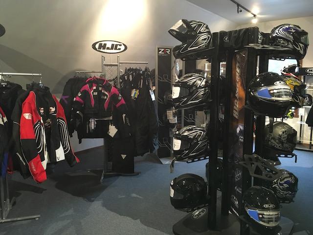Snowmobile jackets and helmets at Village Motors in Speculator.