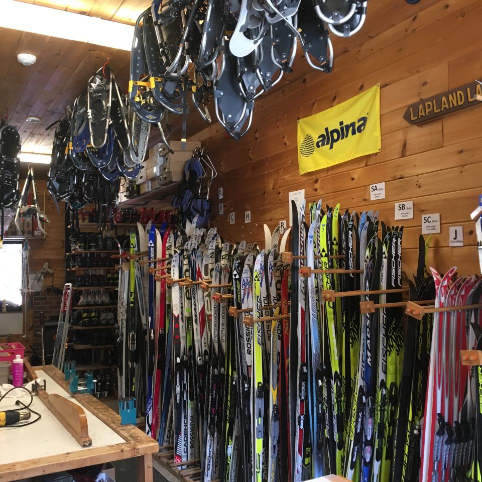 Cross country skis & snowshoes ready for customers in the rental shop