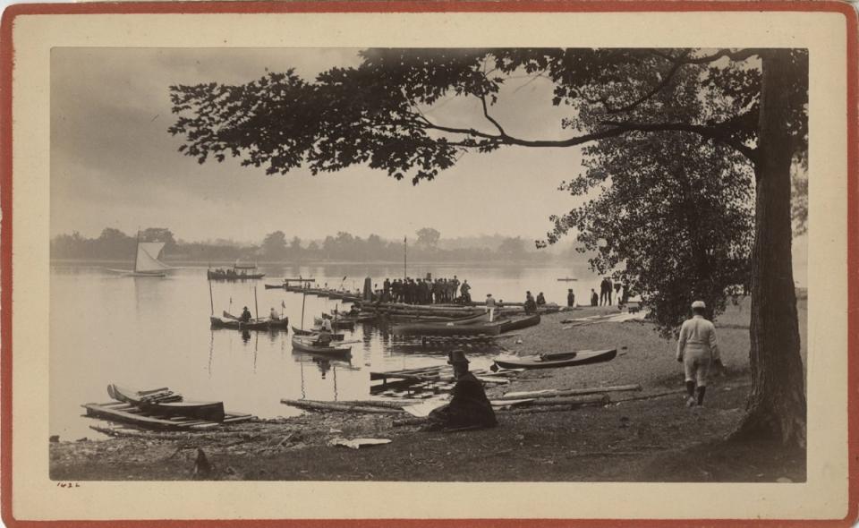 Photo print showing people on the shore watching boats on a lake, Catalog Number 1975.020.0727