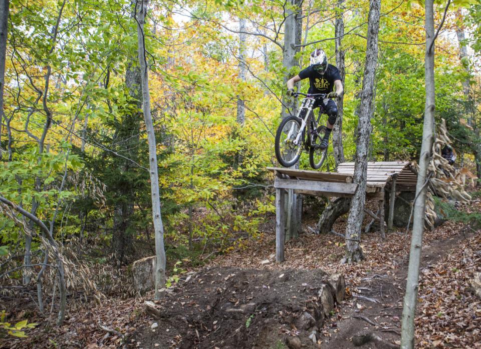 Grab some air on the mountain bike trails at Oak Mountain.