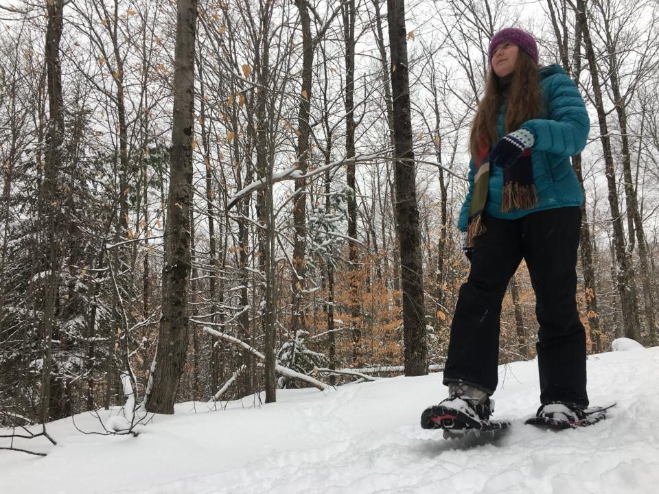 Hiking down a trail on snowshoes