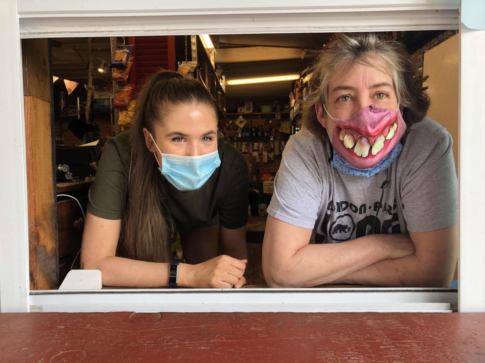 Owner Vickie Sandiford and Employee at Takeout Window