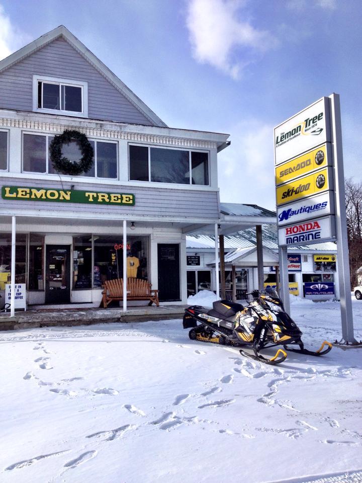 The old Lemon Tree business in winter with a snowmobile out front.