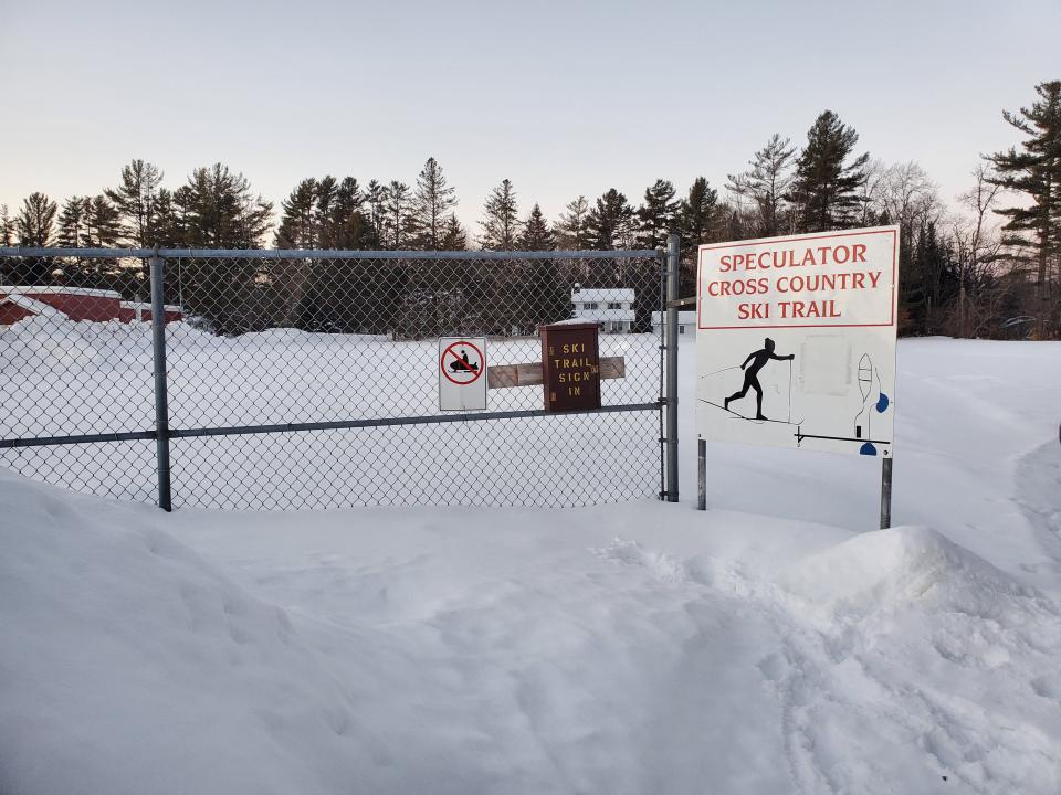 Signs for a snowy cross-country ski trail