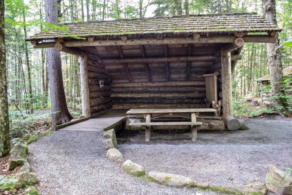 A wheelchair and handicapped accessible lean-to in the forest.