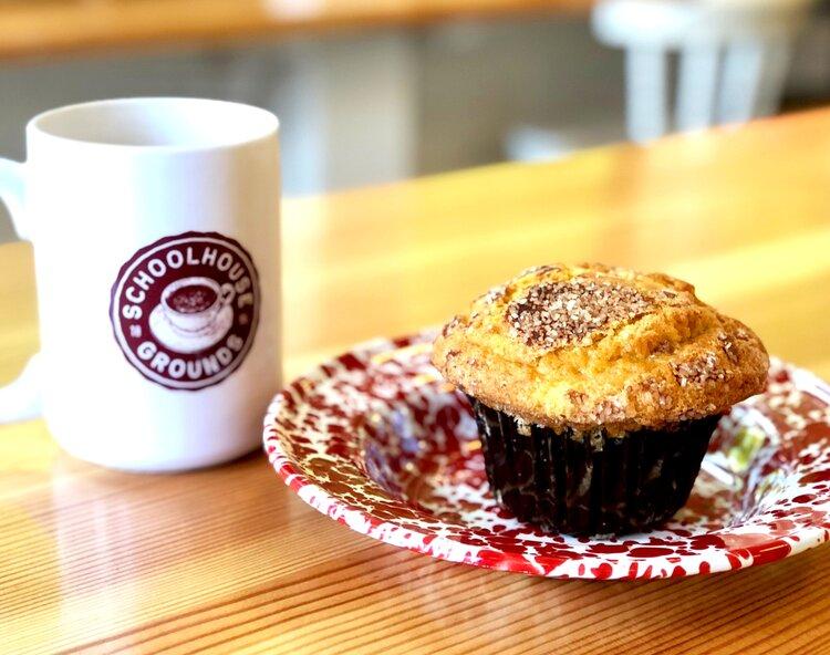 A cup of coffee and a muffin.