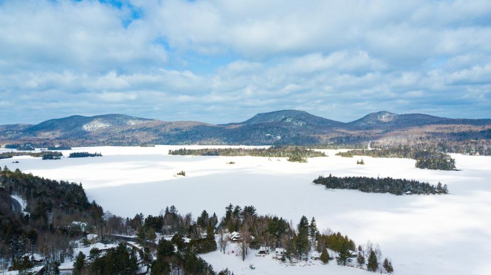 An aerial view of Blue Mountain Lake in the winter.