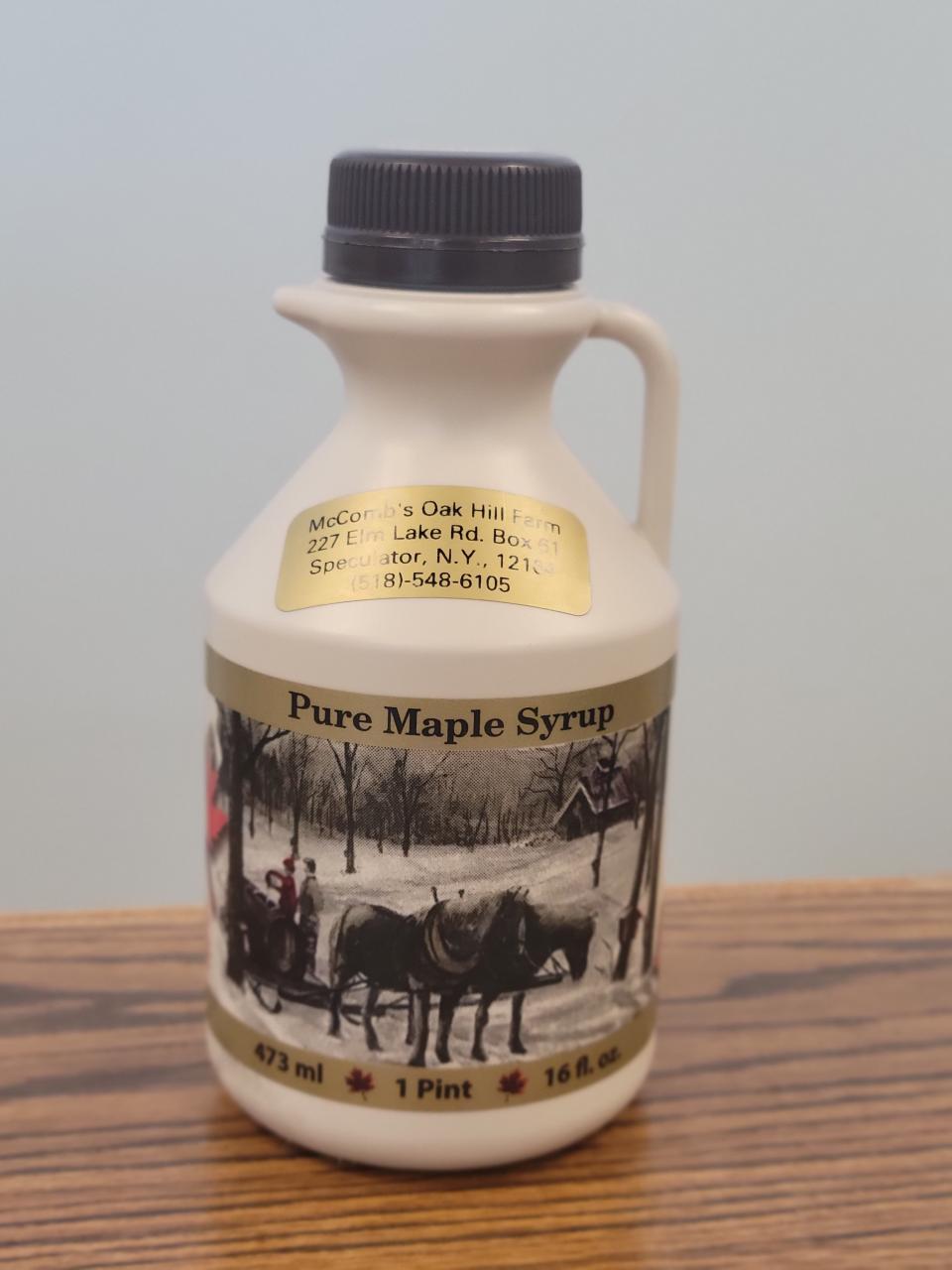 A plastic jug of maple syrup.