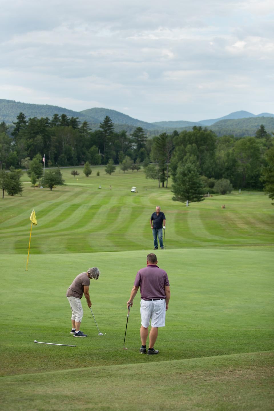 Three golfers on Lake Pleasant Golf Course