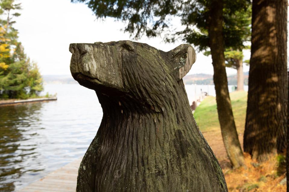 The face of a wooden carved bear at Arrowhead Park in Inlet NY