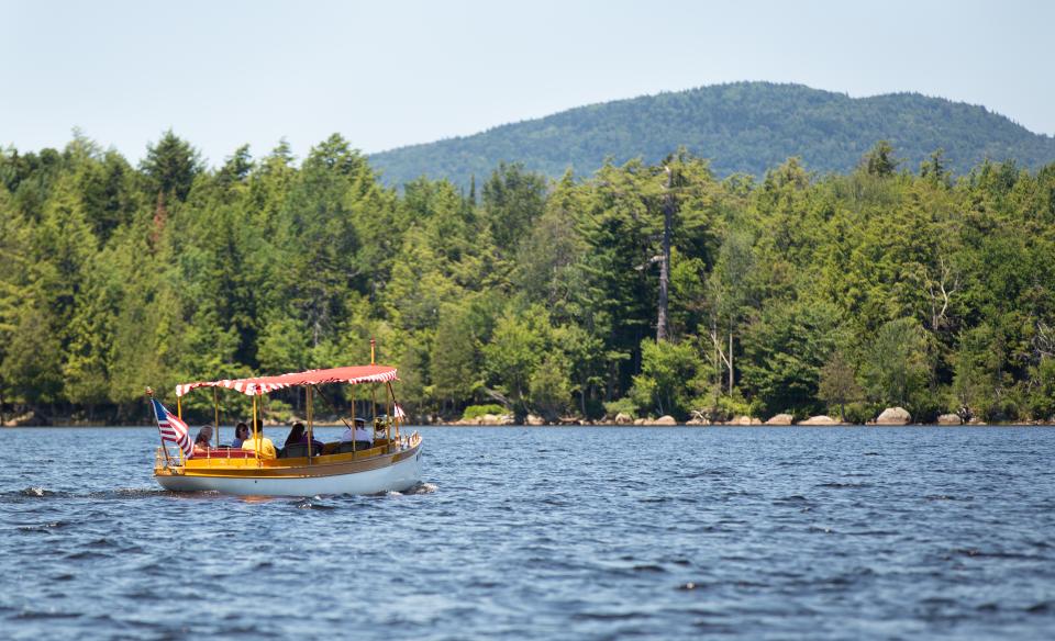 Take an electric boat tour of Raquette Lake.