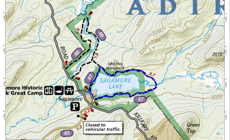 A map of a lake with trails around it.