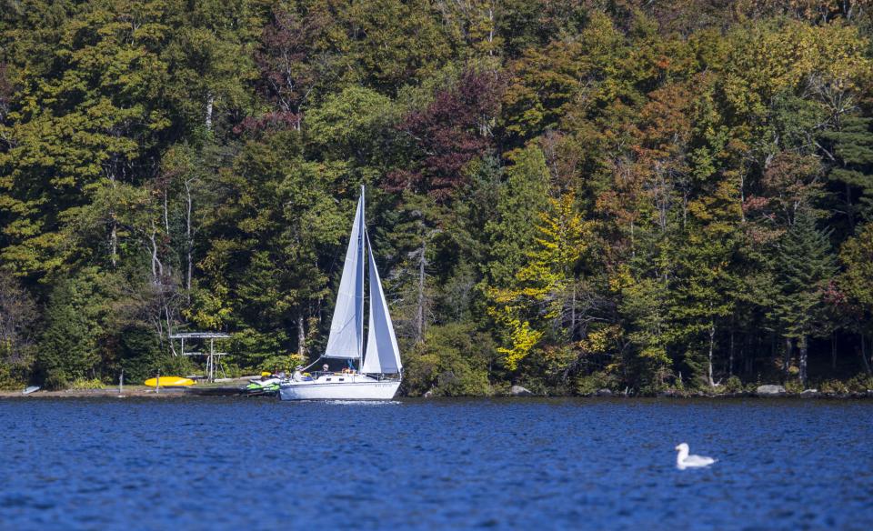 A sailboat coasts across Eighth Lake