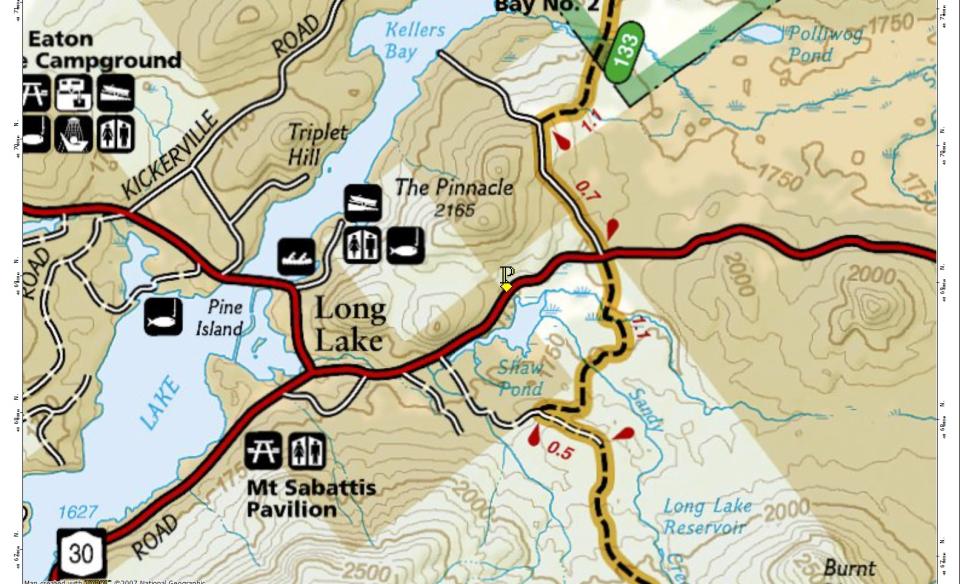 A map showing trails, roads, and a large lake
